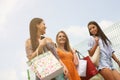 Female young friends doing shopping in the city. Royalty Free Stock Photo