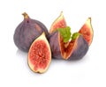 Three figs with mint,split like flower on white backgro