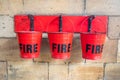 Three Fire Buckets hanging in a row