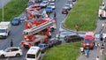 Three fire engines rush to extinguish the fire. Traffic jam. A hose with water will be stretched across the roadway to extinguish