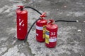 Three fire extinguishers ready for use.