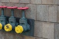 Three fire hydrants on a brick wall in Manhattan New York City