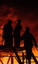 Three Firefighters conferring Royalty Free Stock Photo