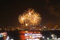 three fireworks on beach and reflection color on water surface of light of city Royalty Free Stock Photo