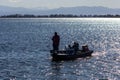 Three fishermen on a boat in the Barr Lake State Park