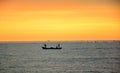 Three fishermen on a small fishing boat Royalty Free Stock Photo