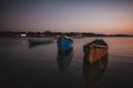 Three fishing boats on the Chapora River during sunset Royalty Free Stock Photo