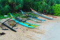 Three fishing boats on the sandy beach of Sri Lanka