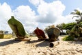 Three fishing canoes docked in the sand on the beach