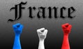 Three fists in the air with the colors of France flag