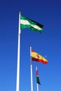 Three flagpoles, Andalusia, Spain. Royalty Free Stock Photo