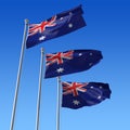 Three flags of Australia against blue sky. 3d illu Royalty Free Stock Photo