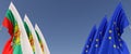 Three flags of European Union and Bulgaria on flagpoles on the sides. Flags on a blue background. Place for text. EU, Europe. Flag Royalty Free Stock Photo