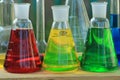 Three flasks with colored liquid reagents. Royalty Free Stock Photo