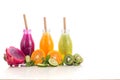 Three flavours of fruit juice in bottles with a straw islolated on white background. Royalty Free Stock Photo