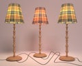 Three floor lamps on wooden legs on a light background