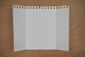 Three folded blank paper leaflet on wooden background Royalty Free Stock Photo