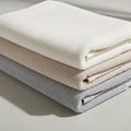 Of three folded microfiber cloths in neutral tones, arranged Royalty Free Stock Photo