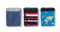 Three folded pairs of men\'s underwear with different patterns displayed on a white background mens underwear Royalty Free Stock Photo