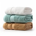 Stacked Cyan And Bronze Towels On White Background