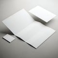 Three folded white paper sheets displayed on a neutral surface Royalty Free Stock Photo