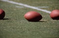 Footballs on a lined football field