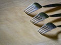 Three forks on a wooden board Royalty Free Stock Photo