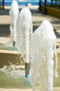 Three fountain water in line in splashing day time