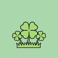 Three Four-Leaf Clovers Growing in a Patch of Grass Royalty Free Stock Photo
