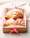 three french butter croissants with powdered sugar