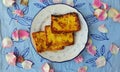 Frech toasts in a blue leave patterned plate with blue outline.