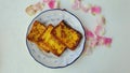 Frech toasts placed in a blue leave pattern and blue out lined plate.