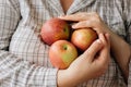 Three fresh apples in a woman hands. Royalty Free Stock Photo