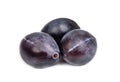 Three fresh blue plums on the white Royalty Free Stock Photo