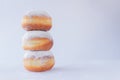 Three fresh doughnuts stacked on each other Royalty Free Stock Photo