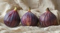 Three fresh figs on cloth. Royalty Free Stock Photo