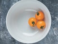 Three fresh organic cherry tomatoes in white bowl Royalty Free Stock Photo