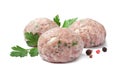 Three fresh raw meatballs with parsley and spices on white background Royalty Free Stock Photo