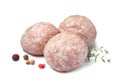 Three fresh raw meatballs with thyme and spices on white background Royalty Free Stock Photo