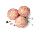 Three fresh raw meatballs with thyme and spices on white background, top view Royalty Free Stock Photo