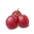 Three fresh red grapes isolated on a white background with a clipping path Royalty Free Stock Photo