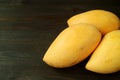 Three Fresh Ripe Mango Whole Fruits Isolated on Black Background