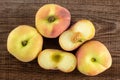 Fresh raw saturn peach on brown wood Royalty Free Stock Photo