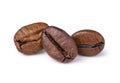 Three fresh roasted dark brown arabica coffee beans isolated on a white background with clipping path Royalty Free Stock Photo