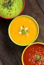 Three fresh soups on a wooden table Royalty Free Stock Photo