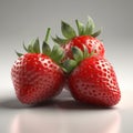 Three fresh strawberries on gray background