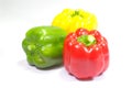 Three fresh sweet peppers on white background