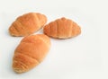 Three freshly baked croissants on a white background Royalty Free Stock Photo