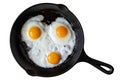Three fried eggs in cast iron frying pan isolated on white from