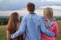 Three friend looking at the city panorama.